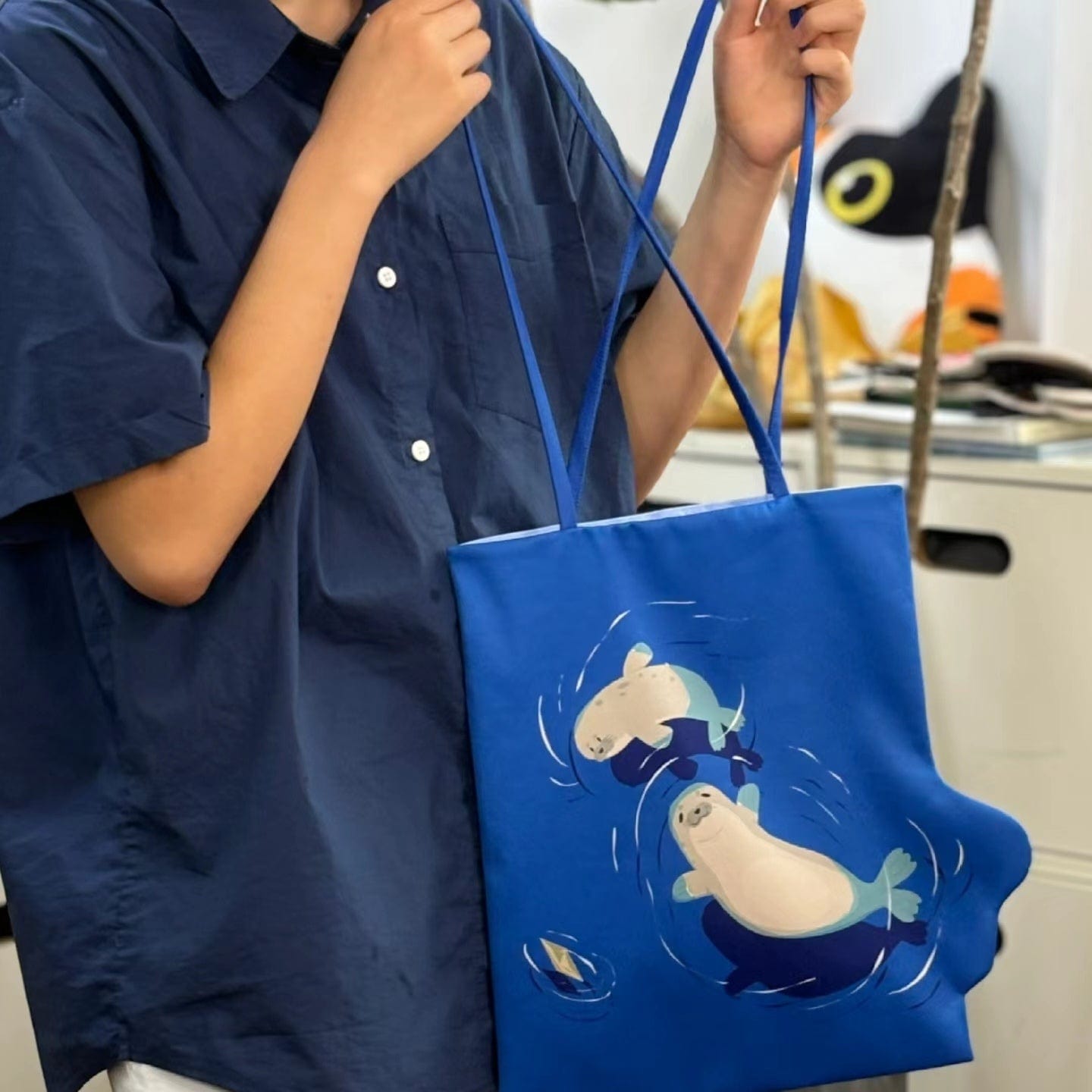 Dual-Sided Orca vs Seal Shoulder Bag
